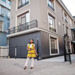 African woman in yellow
